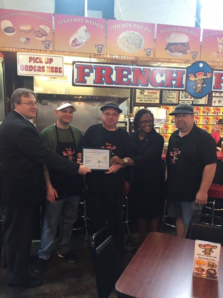 Photo of Ron and the team with Mayor Bracey, receiving the Mayor’s Merchant of the Month award in 2016.